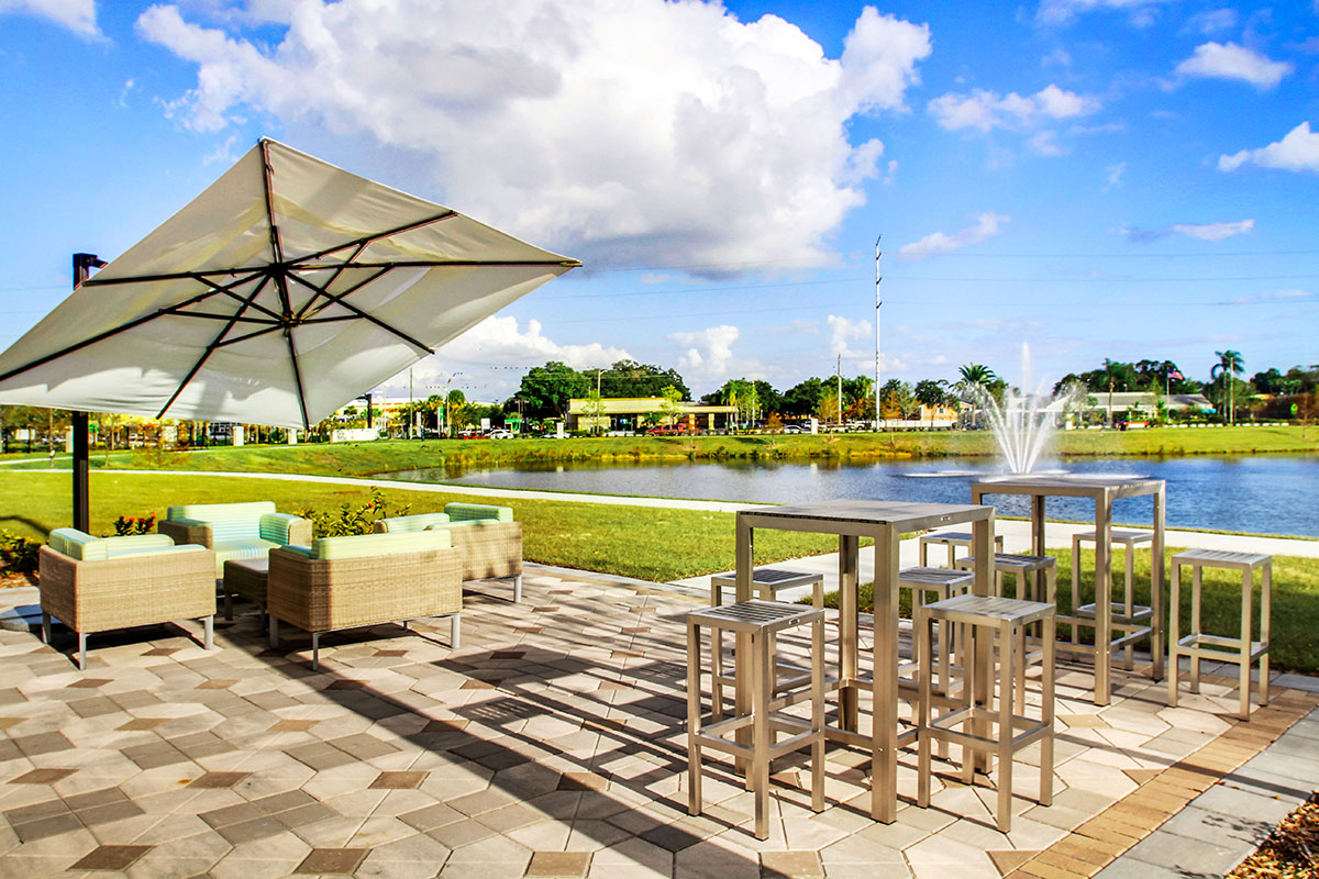 lounge area beside pond with fountain
